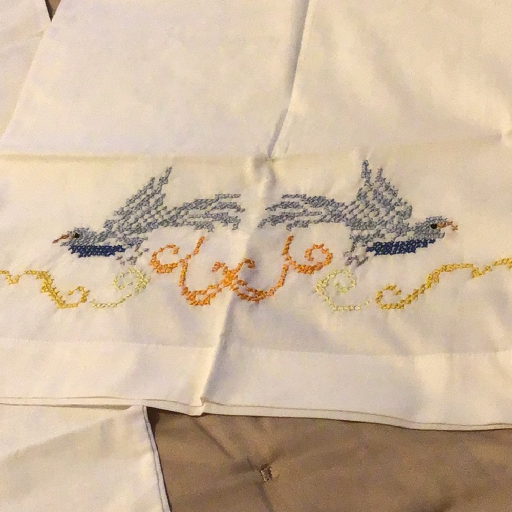 Hand cross stitched pillowcases pair